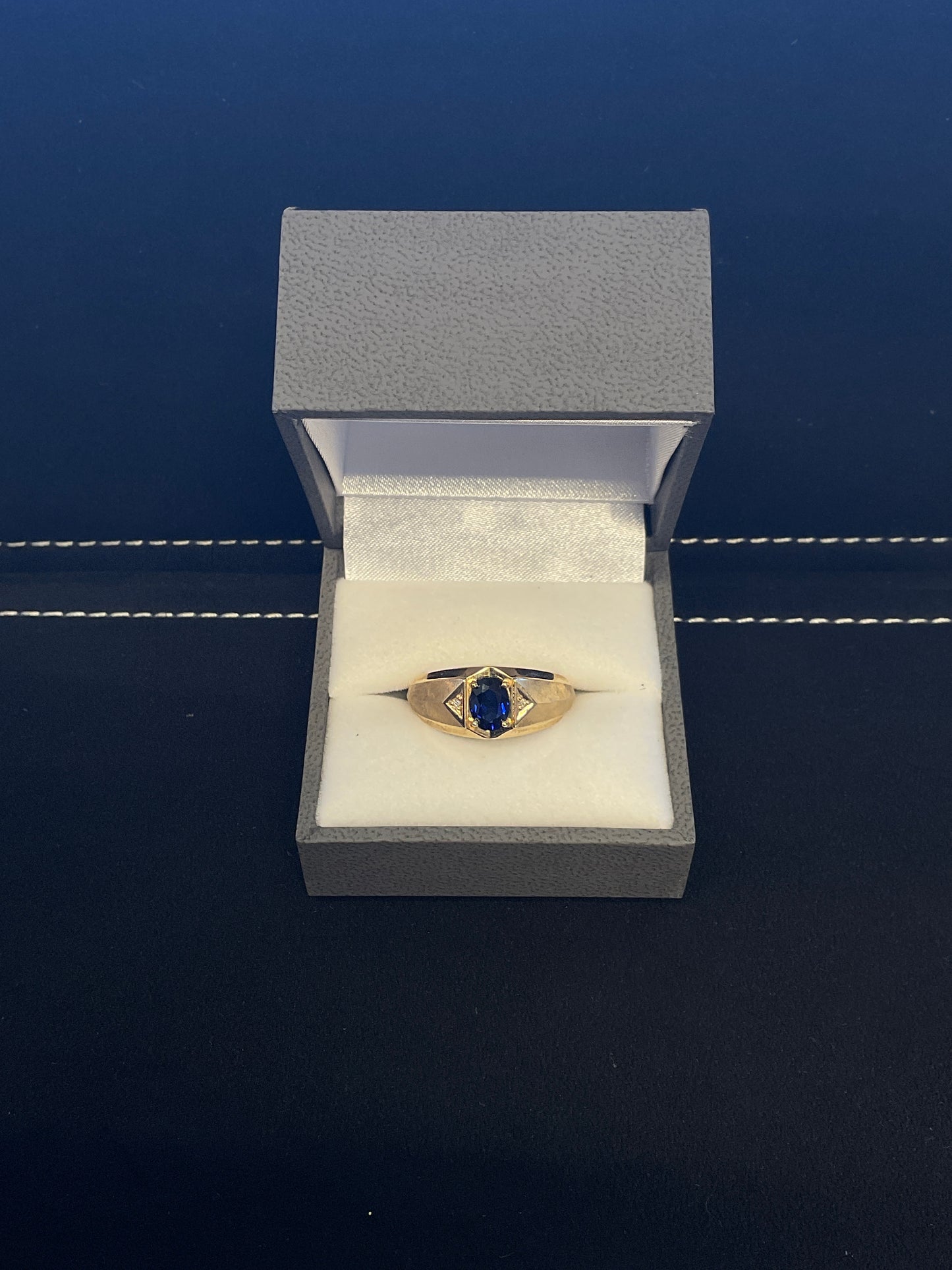 Oval Cut Blue Sapphire 10KT Yellow Gold Brushed / Polished Ring with Round Brilliant Cut Diamond Accents