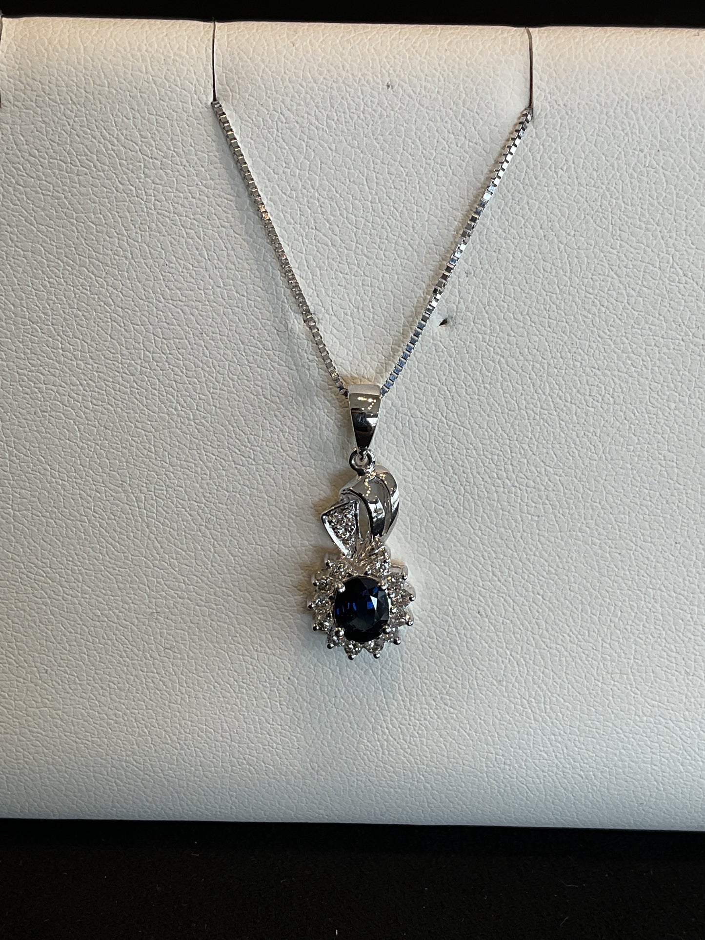 Oval Cut Blue Sapphire with Round Brilliant Cut Diamond Halo14KT White Gold Fancy Drop Necklace with Diamond Accents 18" 14KT White Gold Chain