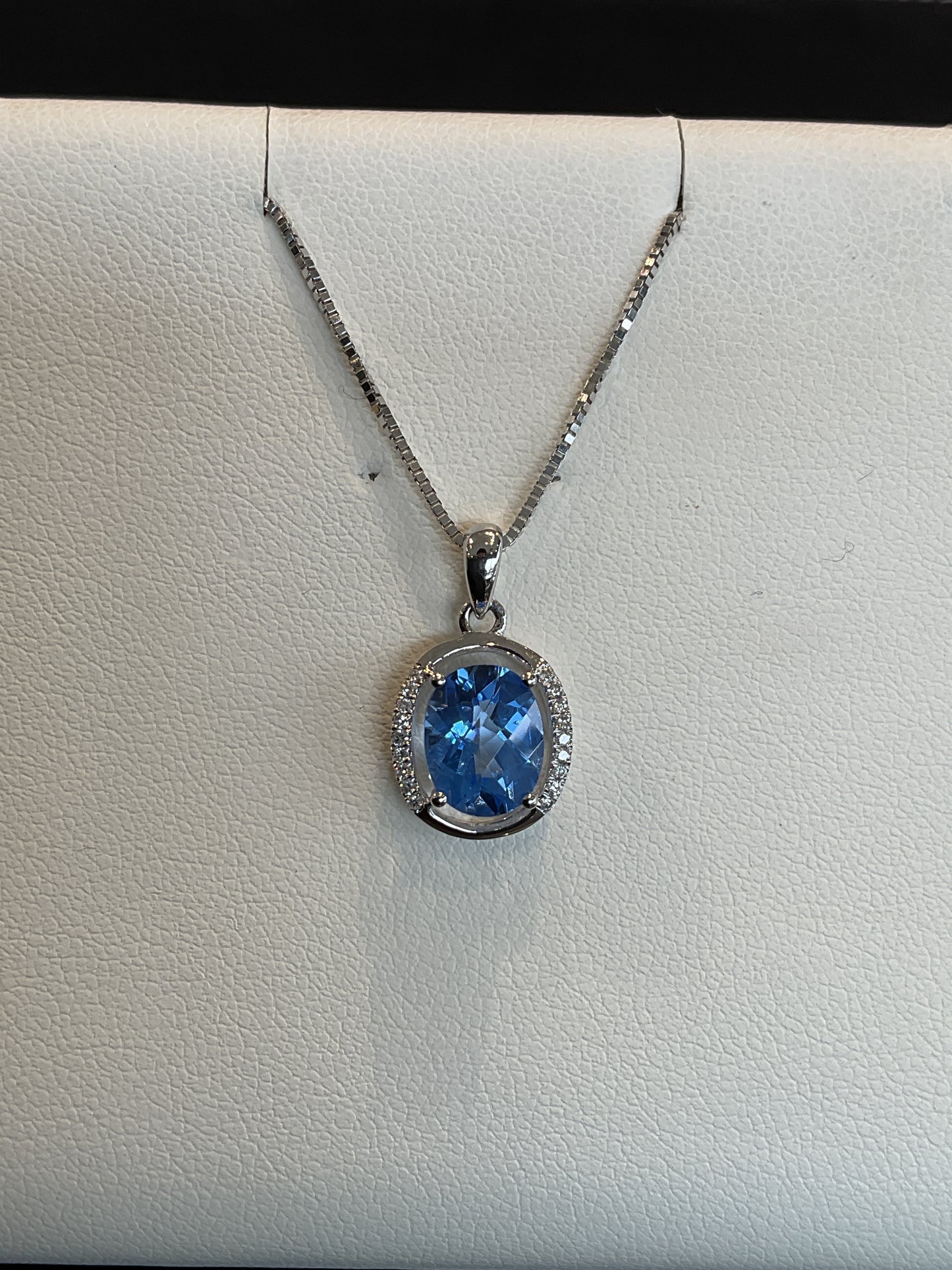 Oval Cut Glacier Blue Topaz with Polished and Round Brilliant Cut Diamond Accent Halo 14KT White Gold Necklace 18" 10KT White Gold Chain