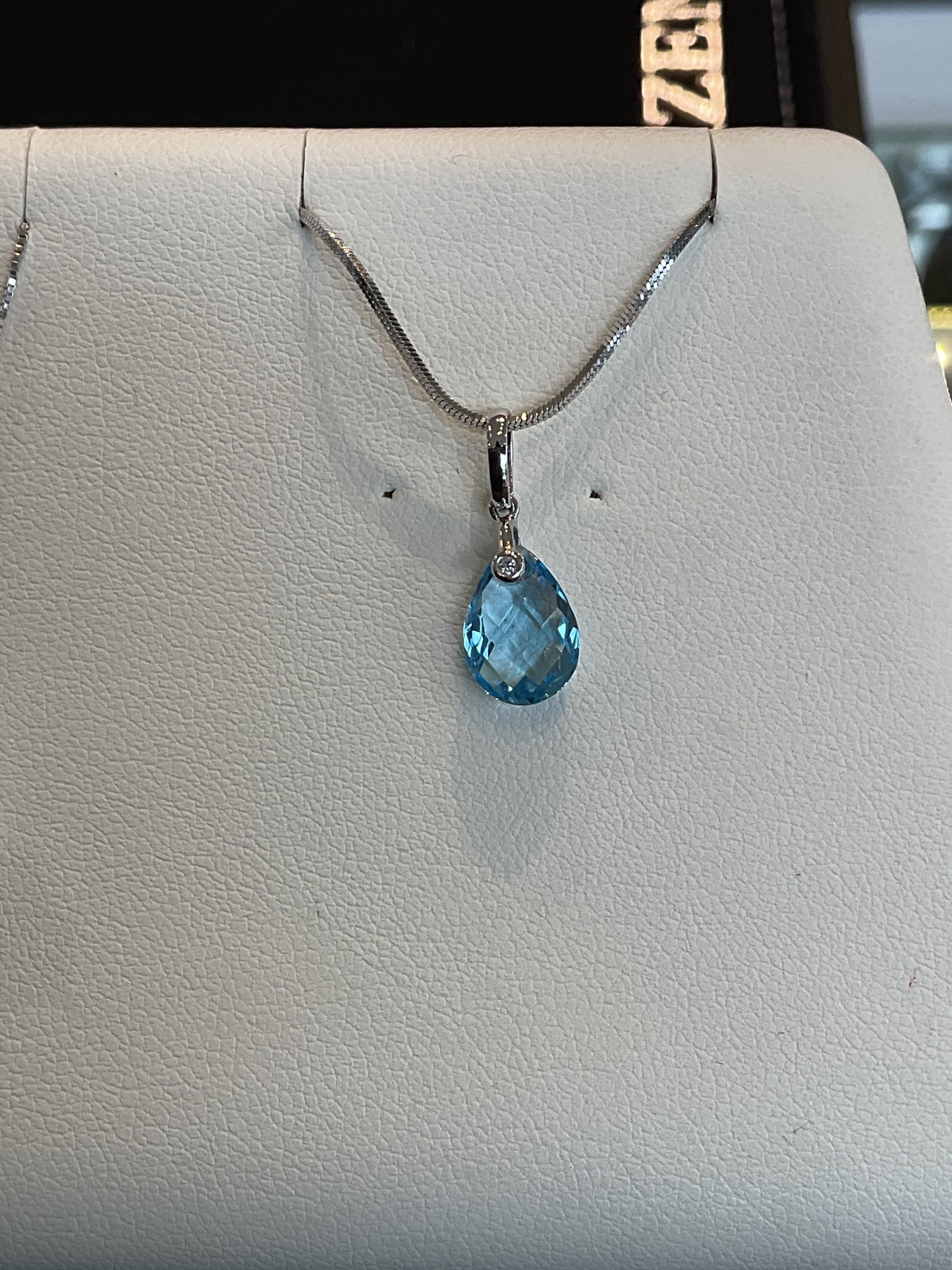 Faceted Checkered Pear Cut Blue Topaz with Round Brilliant Cut Bezel Set Diamond Accent 14KT White Gold Drop Necklace