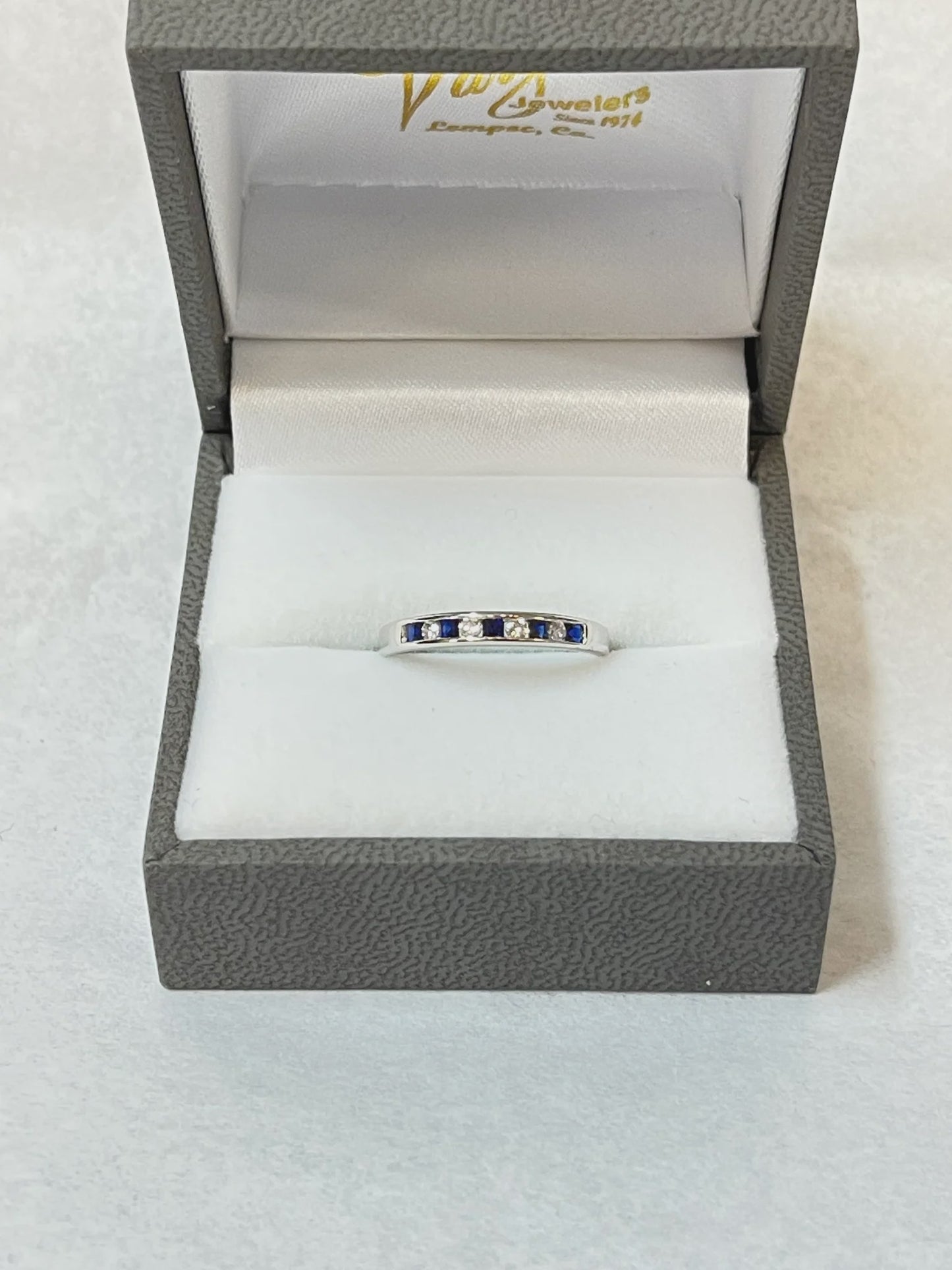 Round Brilliant Cut Diamond and Blue Sapphire Channel Set 14KT White Gold Band