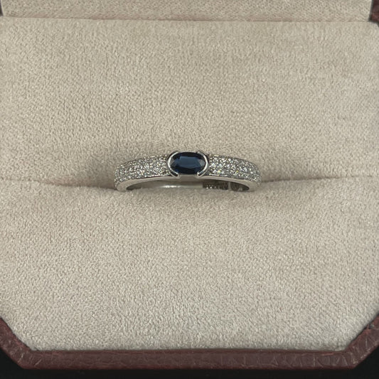 Oval Cut Bezel Set Blue Sapphire 14KT White Gold Ring with Round Brilliant Cut Diamond Shank