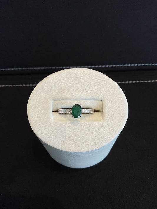 Oval Cut Emerald 14KT White Gold Ring with Round Brilliant Cut Bezel Set Diamond Accents