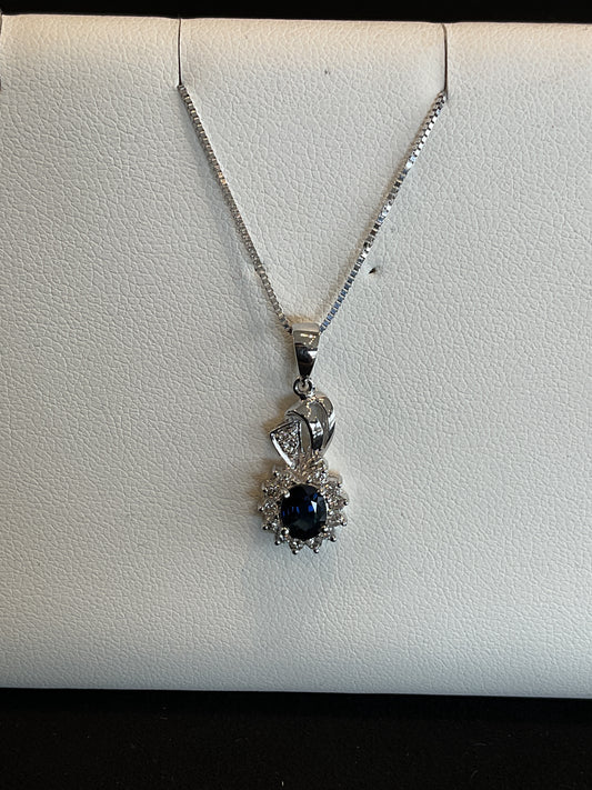 Oval Cut Blue Sapphire with Round Brilliant Cut Diamond Halo14KT White Gold Fancy Drop Necklace with Diamond Accents 18" 14KT White Gold Chain