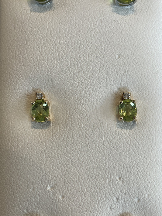 Oval Cut Faceted Peridot Prong Set 14KT Yellow Gold Stud Earrings with Single Round Brilliant Cut Diamond Accent