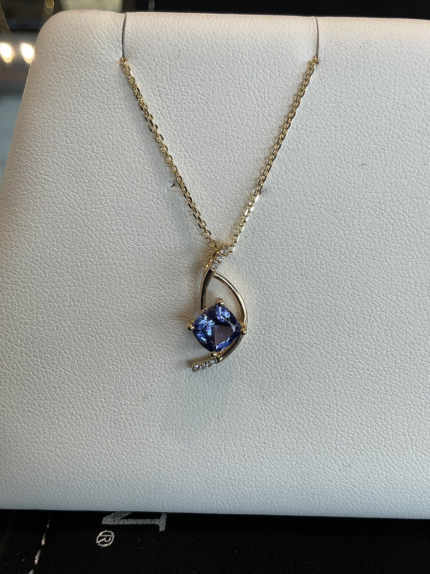 Cushion Cut Tanzanite with Round Brilliant Cut Diamond Accents set in 14KT Yellow Gold Abstract Design Necklace 18" 14KT Yellow Gold Chain