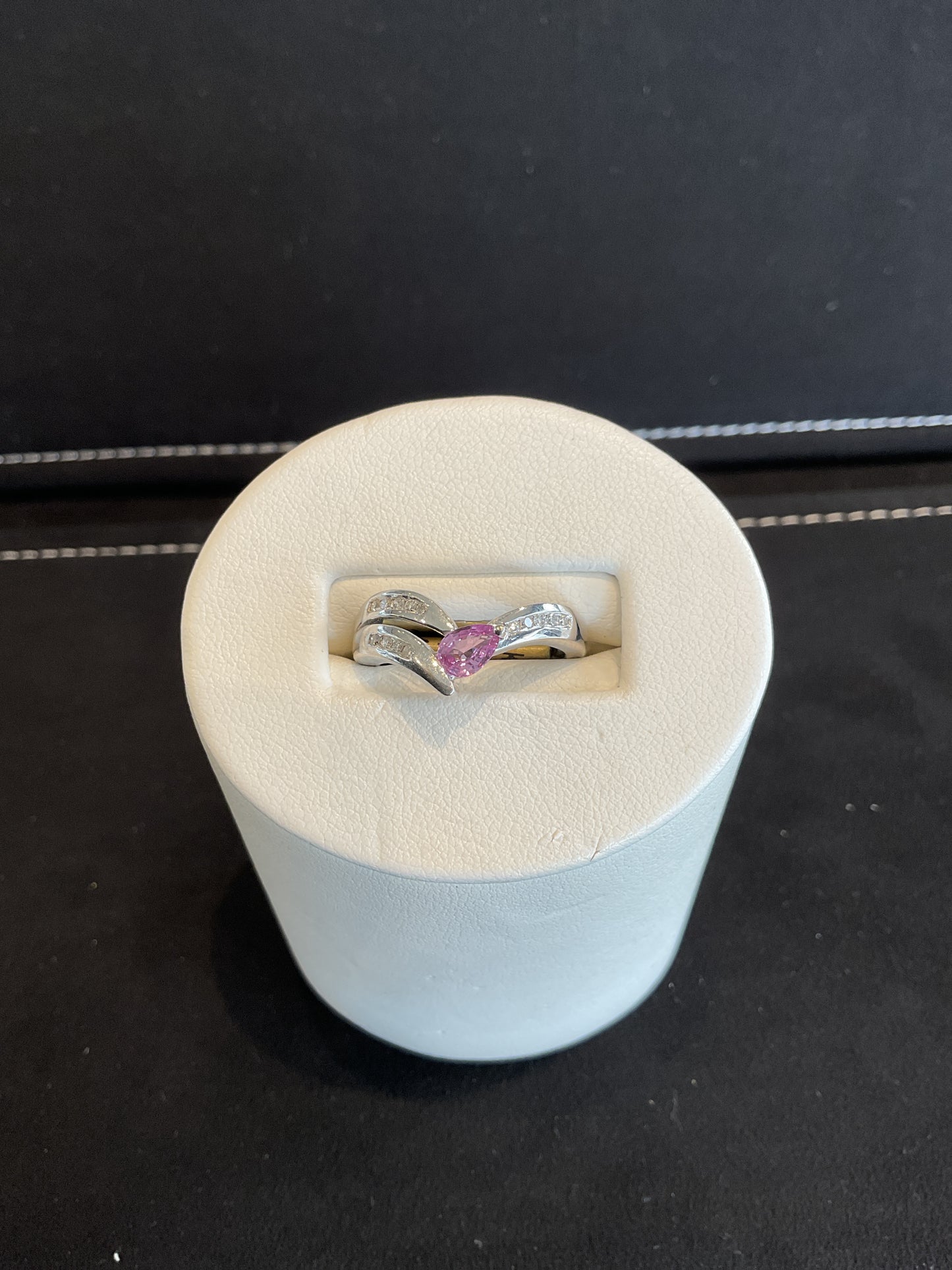 Pear Cut Pink Sapphire 14KT White Gold Fancy Ring with Channel Set Round Brilliant Cut Diamonds