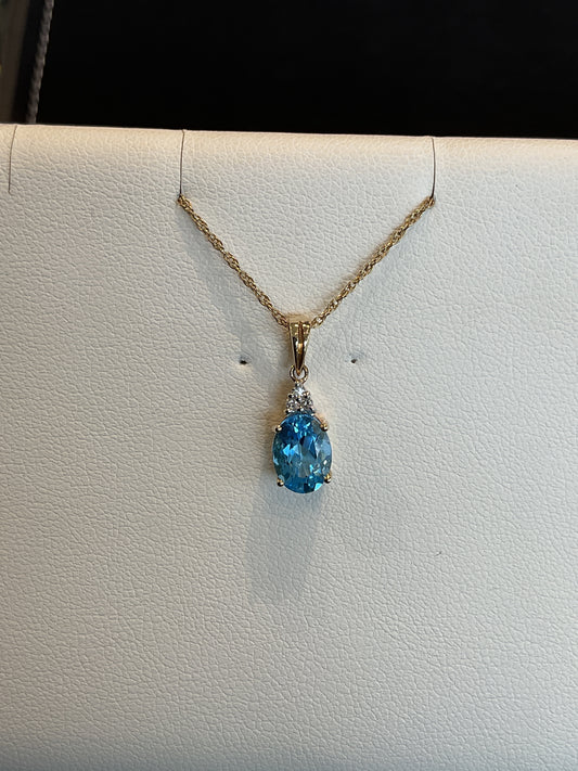 Oval Cut Blue Topaz with 3 Prong Shared Round Brilliant Cut Diamond Accents 14KT Yellow Gold Necklace 18" 14KT Yellow Gold Chain