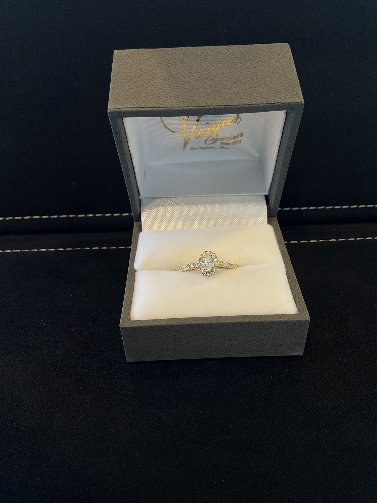 0.47CTW Oval Cut Diamond 14KT Yellow Gold Engagement Ring with Round Brilliant Cut Halo and Shank