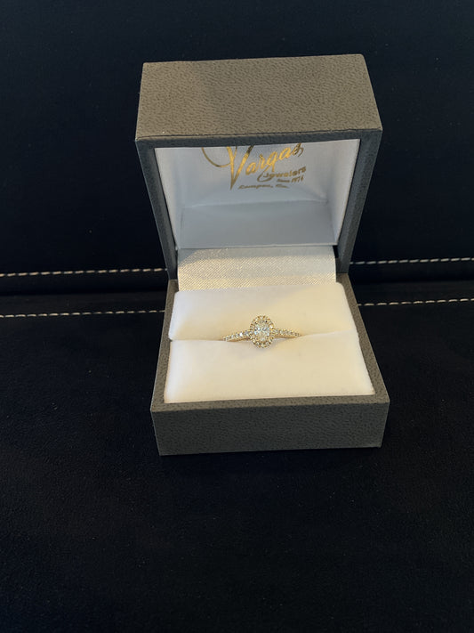 0.47CTW Oval Cut Diamond 14KT Yellow Gold Engagement Ring with Round Brilliant Cut Halo and Shank