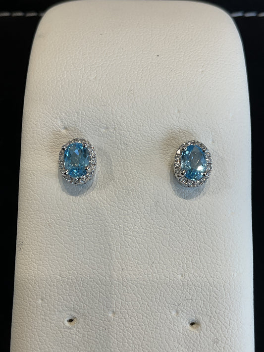 Oval Checkered Cut Blue Topaz Prong Set 14KT White Gold Round Brilliant Cut Diamond Halo Stud Earrings