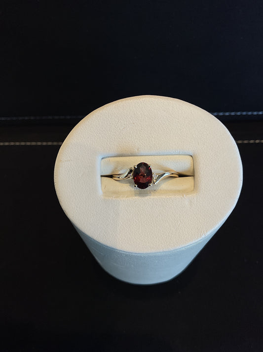 Oval Checkerboard Cut Red Garnet 14KT Yellow Gold Ring with 2 Round Brilliant Cut Diamond Accents